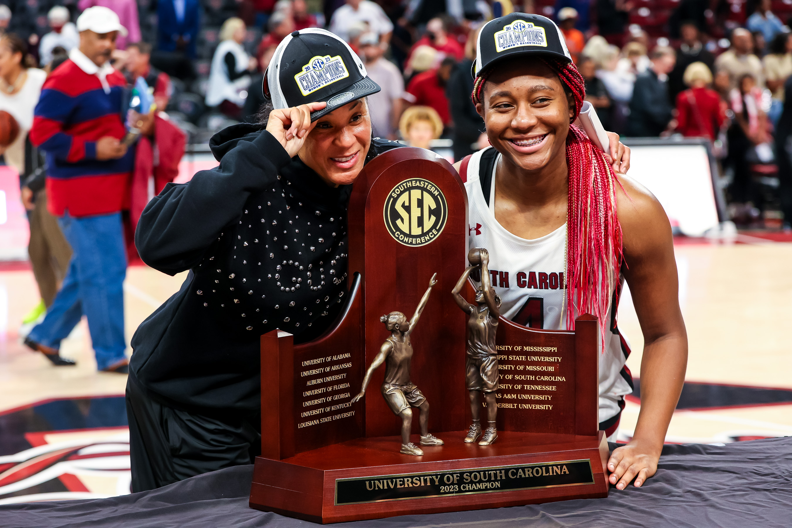 South Carolina Gamecocks head coach Dawn Staley and forward Aliyah Boston (4) pose with the 2023 SEC Regular Season Championship trophy